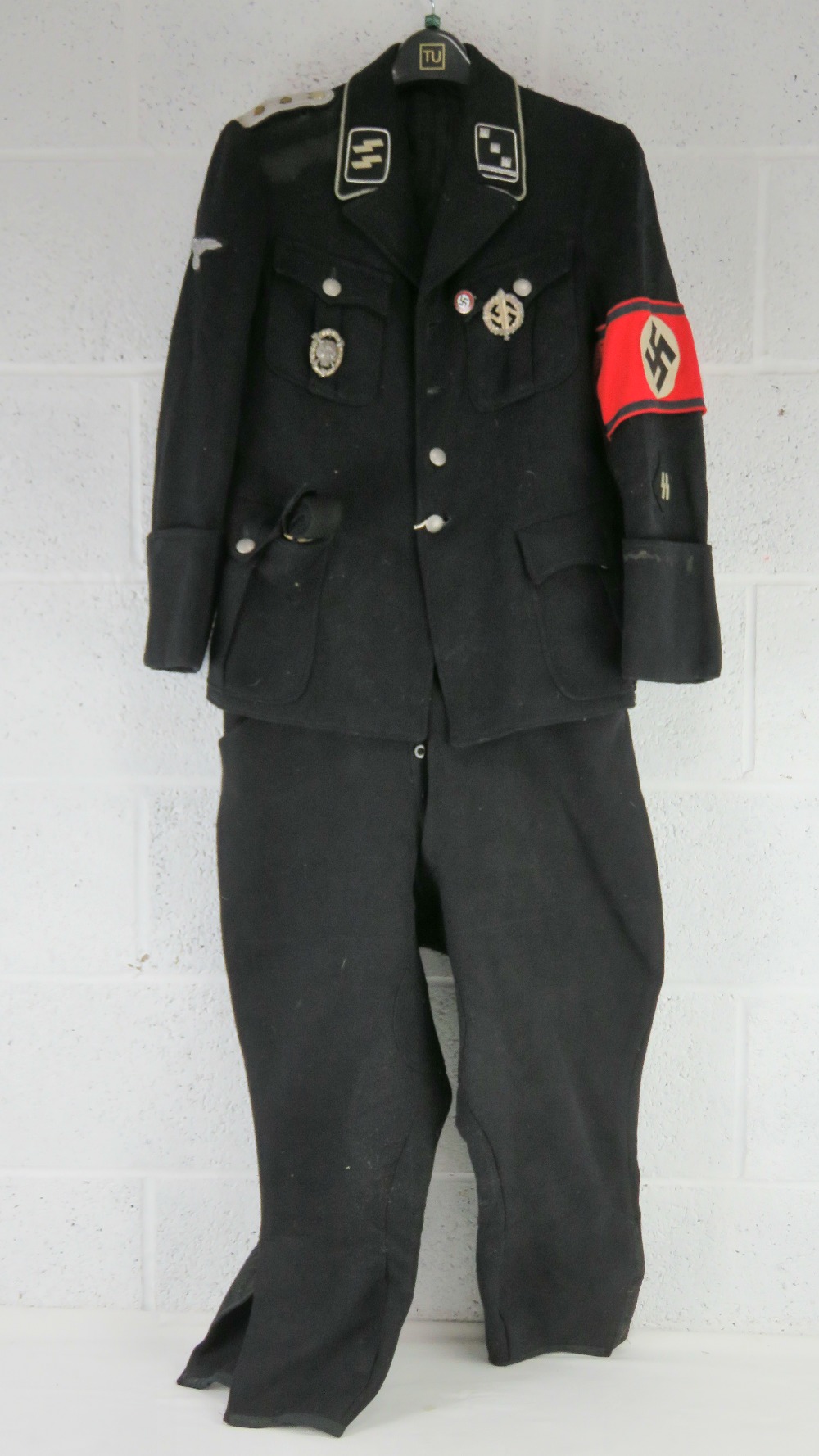 A re-enactor's SS German WWII tunic with insignia,