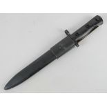 A LIA3 bayonet having black painted handle, black metal associated scabbard and leatherette frog.