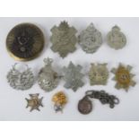 A quantity of assorted large size British regiment cap/helmet badges, approx 11 items, inc Artist's,