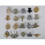 A quantity of assorted British regiment cap/helmet badges, approx 20 items, inc RAF,