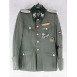 A repro Totenkopf tunic with awards (size S).