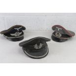 Three reproduction German WWII officers caps, size 57, 56 and 56.