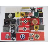 A quantity of assorted German items, armbands, wallets, cloth badges, tie, shoulder boards.