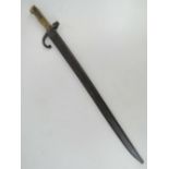 A French Chassepot 1869 bayonet and scabbard, engraved to back edge, numbered 17829,