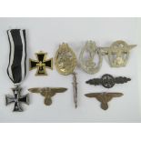 A quantity of assorted reproduction German badges and medals. Nine items.