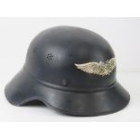 A WWII German helmet, stamped RL2-39/21, probably over painted, having applied Luftschutz to front.