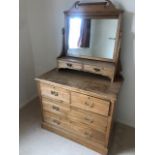 An Edwardian mirror top wash stand having twin jewellery drawers over two drawer and two door base,
