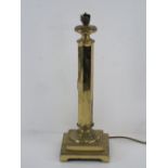 A brass table lamp having stepped base and standing 42cm high, not inc fitting (for re-wring).