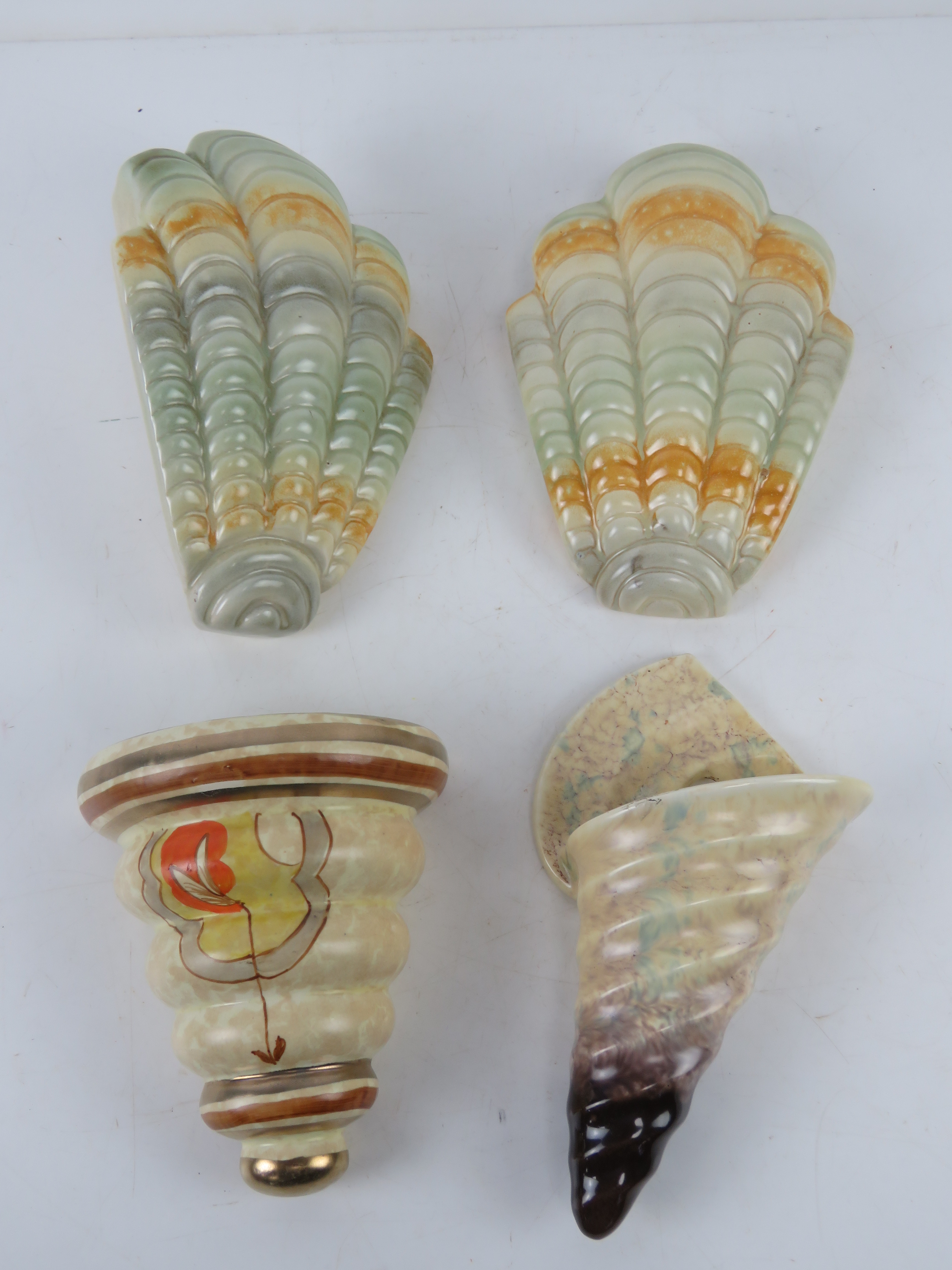 A quantity of assorted ceramic wall pockets; a pair of Shorter & Sons shell shaped pockets,