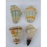 A quantity of assorted ceramic wall pockets; a pair of Shorter & Sons shell shaped pockets,