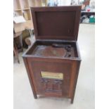 An early New Universal radiogram having turntable with Bakelite stylus to the top,