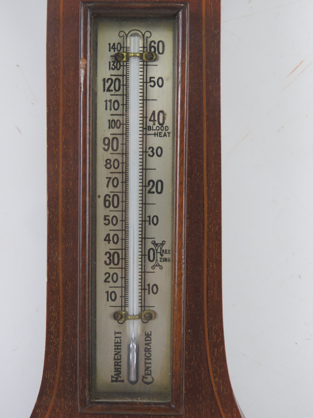 An Edwardian mahogany and inlaid wall barometer having thermometer over aneroid barometer marked - Image 2 of 4