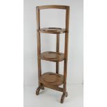 A c1930s oak folding cake / plate stand.