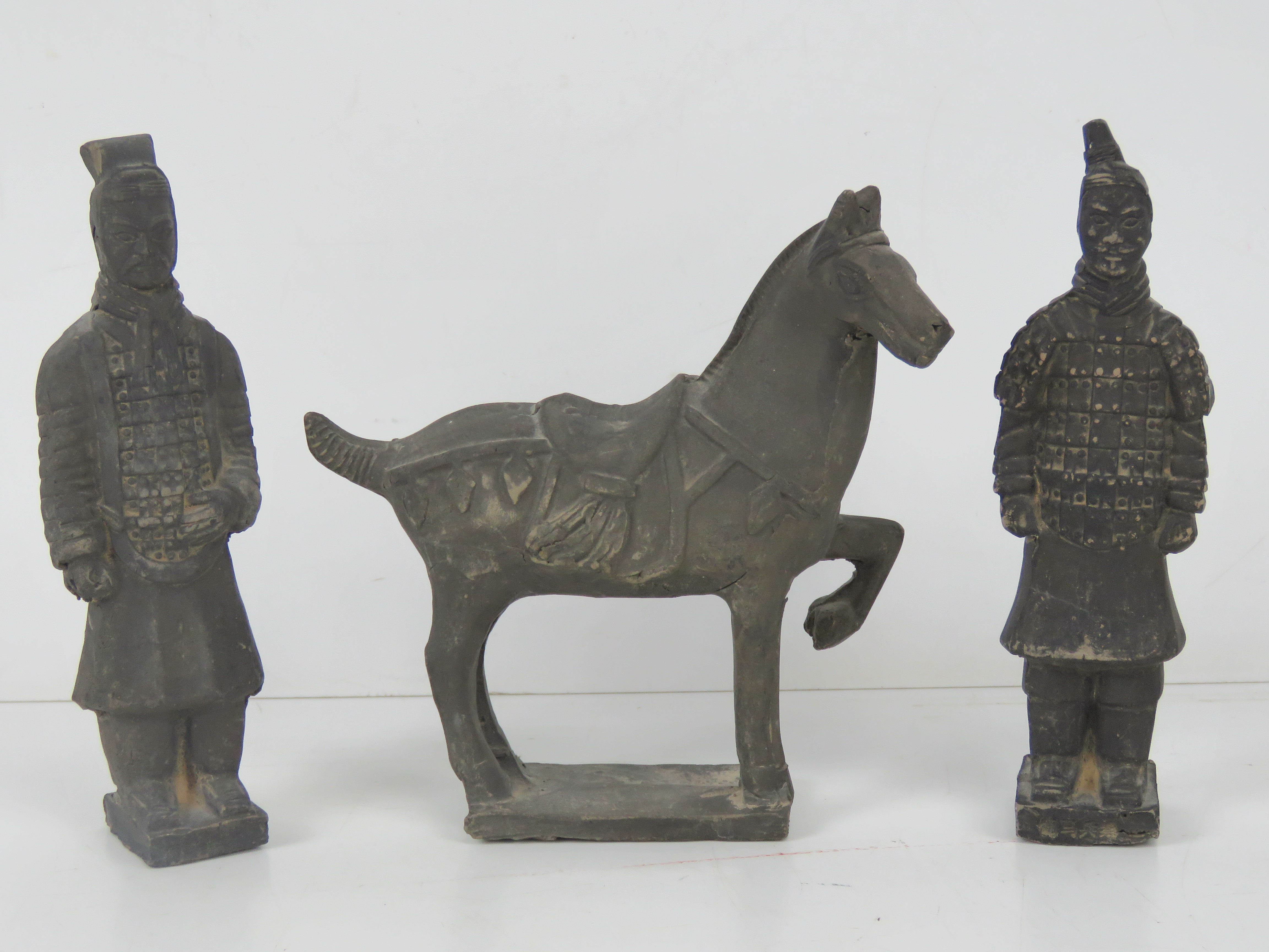 A pair of terracotta Chinese Warrior figurines, each standing 17cm high,