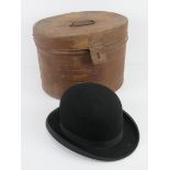 A vintage bowler hat having leather liner marked 'long oval',