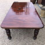 A good wind-out extending mahogany dining table.