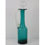 A turquoise and clear glass claret jug standing 39cm high.