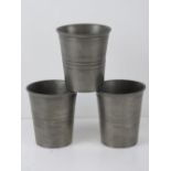 Three German pewter cups having Stuttgart labels and featuring engraved crest upon, each 11.