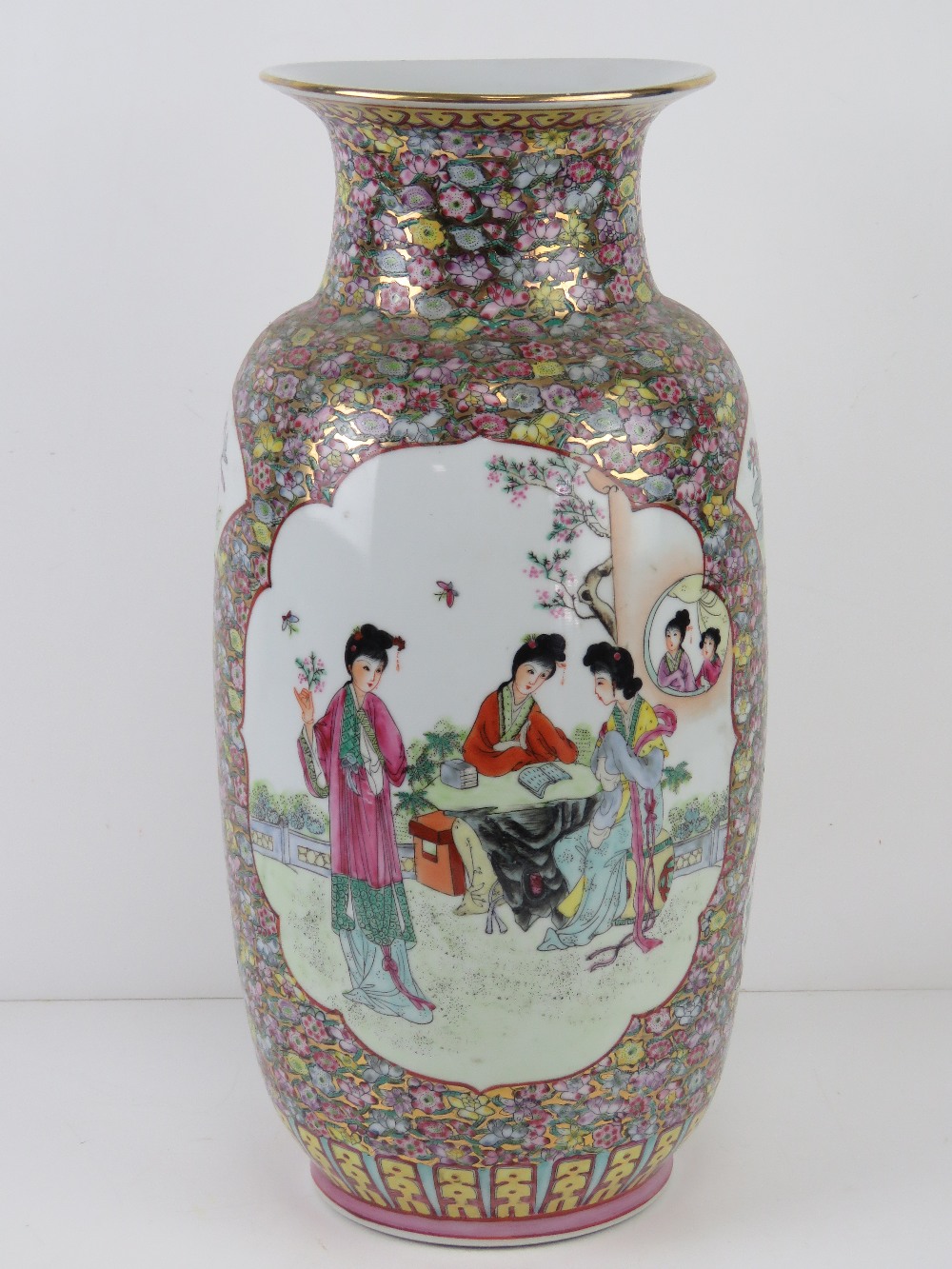 A large Chinese shoulder vase having female figures upon with pink and blue floral decoration and