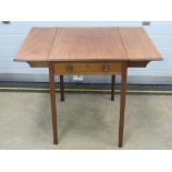 An Edwardian mahogany occasional drop leaf table having single drawer under and raised over four