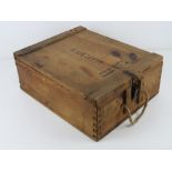 A German LEFH wooden ammunition crate with handle and labels. Dated 1944.