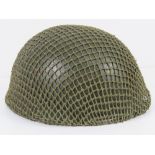 A British Paratrooper's helmet with liner and helmet net, dated 1983.