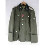 A reproduction WWII German SS Battle Tunic size XL.