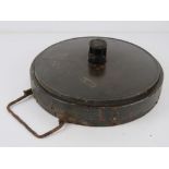 An inert WWII German Teller Anti Tank mine, dated 1939, with fuse but no base.