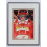 A photographic print of Jean Alesi Ferrari F1 Driver in his racing car, framed and mounted,