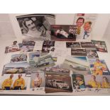 Two hand signed photographic postcards of Sir Sterling Moss,