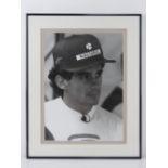 A photographic print of Ayrton Senna (1960-1994) World Champion 1988, 1989 and 1991,