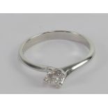 A platinum and diamond solitaire ring wi