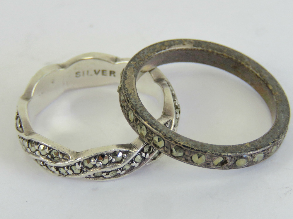 Two silver and marcasite rings, one bein