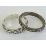Two silver and marcasite rings, one bein
