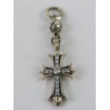 A silver Crucifix pendant set with white