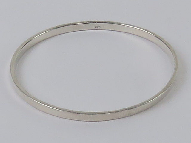 An HM silver bangle of plain design, int