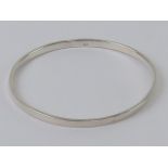 An HM silver bangle of plain design, int