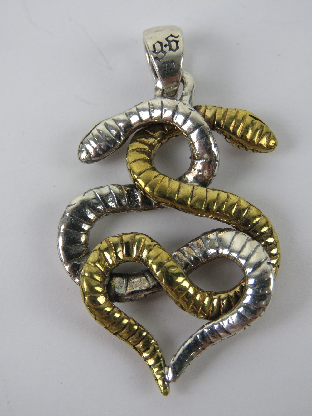 A silver pendant in the form of two entw - Image 2 of 3