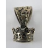 A pendant in the form of a crown, stampe