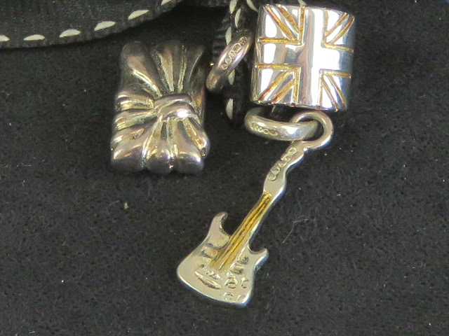 Links of London; three silver charms hav