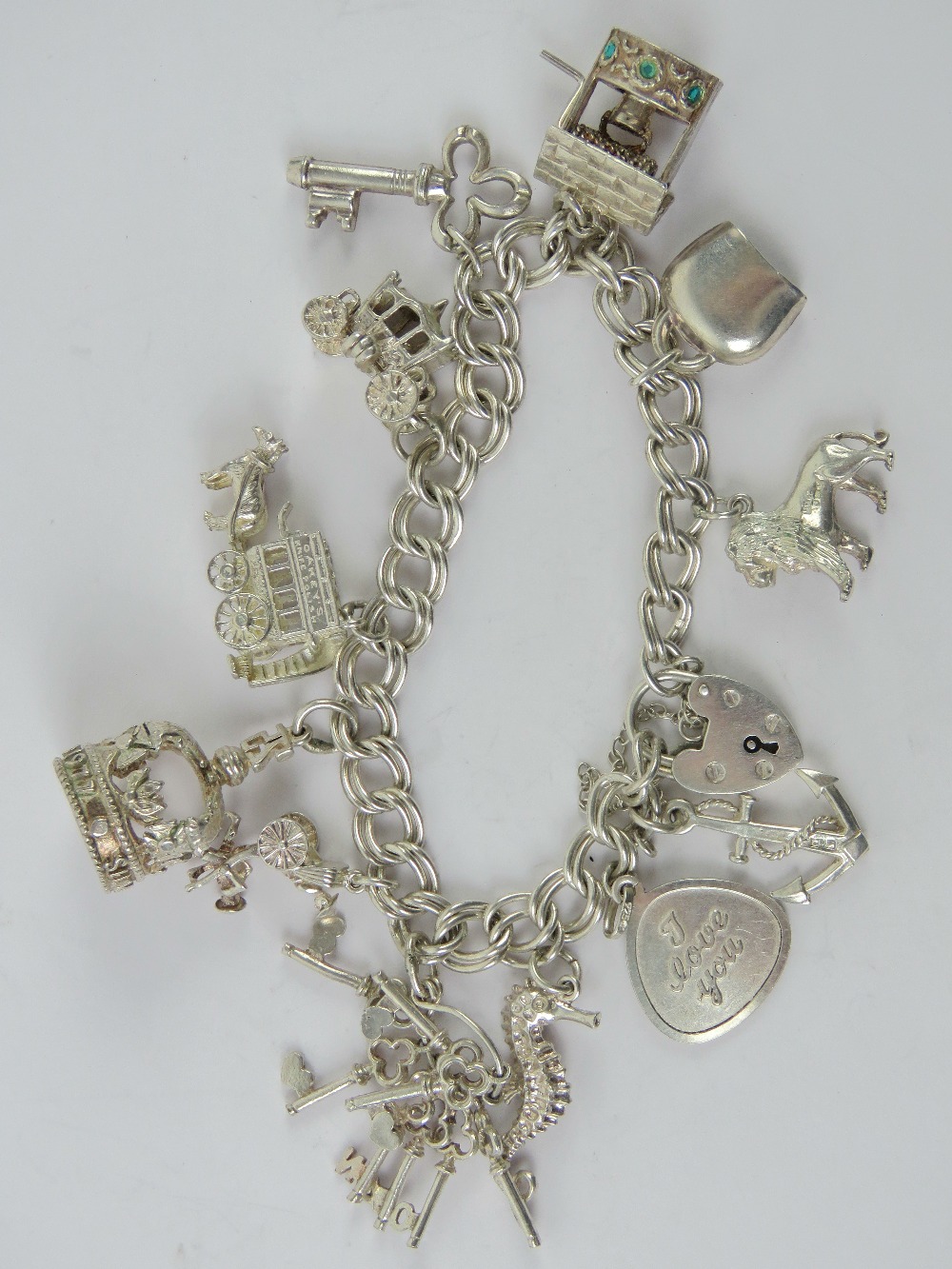 An HM silver double link charm bracelet