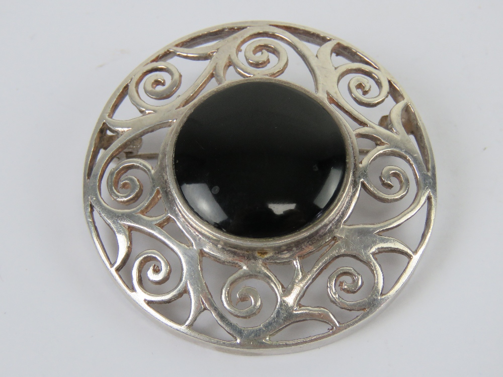 A large Celtic style silver and onyx pla