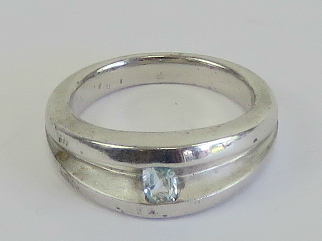 A HM silver ring having central aquamari