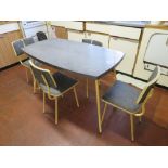 A classic 1960's kitchen table set comprising table (120 x 68cm) raised over slanted pole legs and