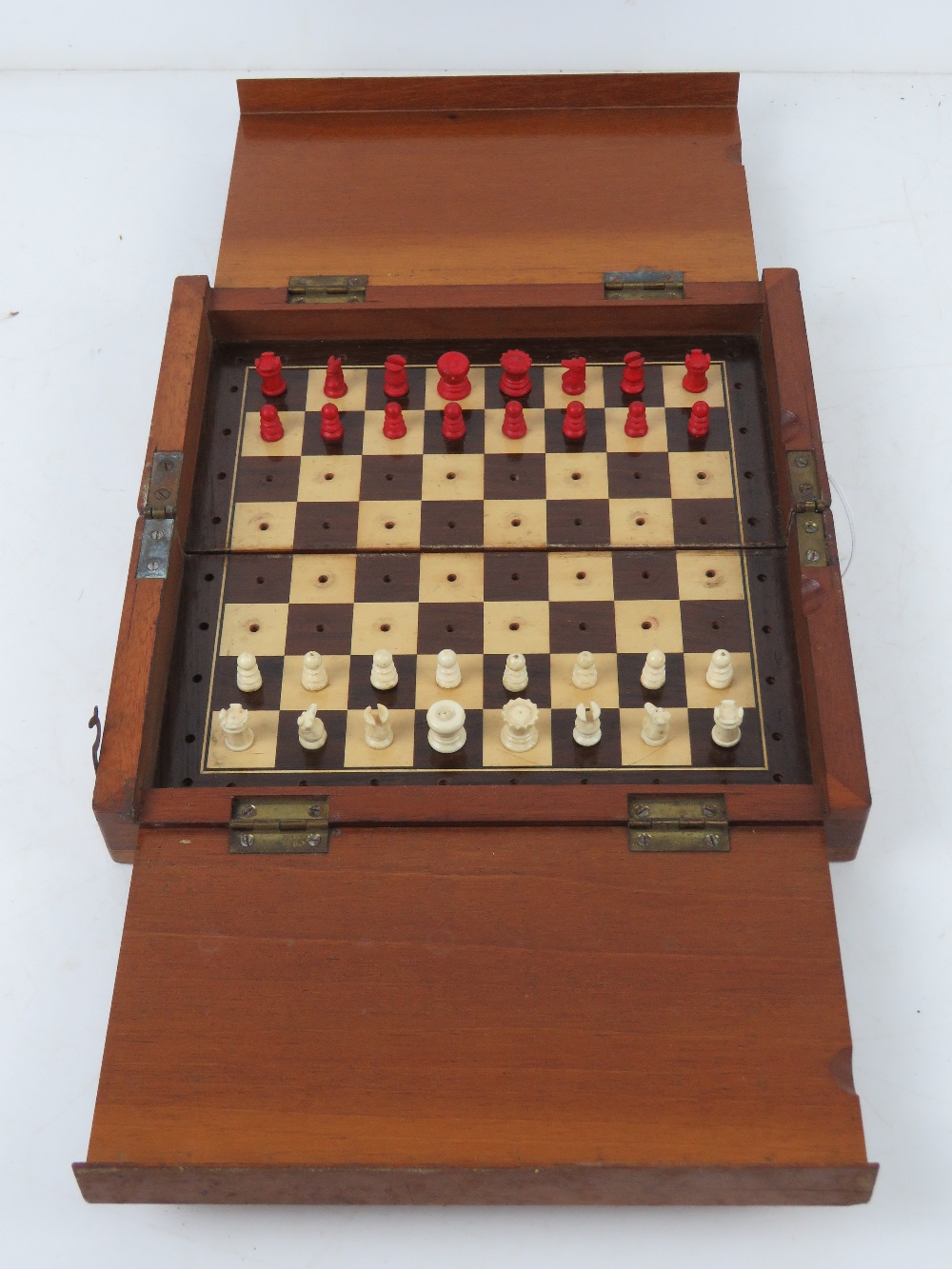 A Whittington style portable chess set with red stained and natural bone pieces, board 22.