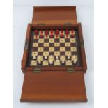 A Whittington style portable chess set with red stained and natural bone pieces, board 22.