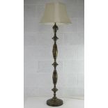 A finely engraved brass standard lamp complete with cream silk shade.