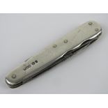An HM silver multi-tool pocket knife, hallmarked for Sheffield.