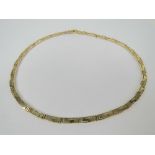 A 14ct gold Greek Key pattern necklace, 43.5cm in length, tongue clasp, stamped 585, 20.