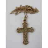 A filigree crucifix on 9ct gold chain necklace, cross measuring 2.7cm inc bale. In presentation box.